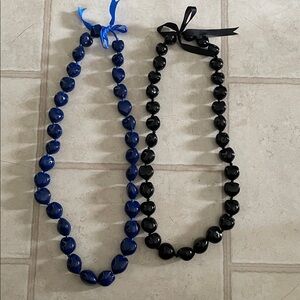 Hawaiian kukui nuts lei lot of 2, new without tag
Blue and black